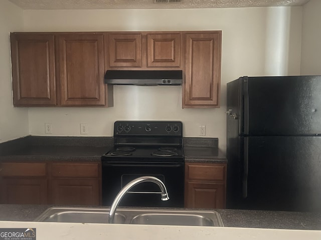 14104 Fairington Ridge Cir, Lithonia, GA 30038 - kitchen with black appliances, under cabinet range hood, dark countertops, and brown cabinetry