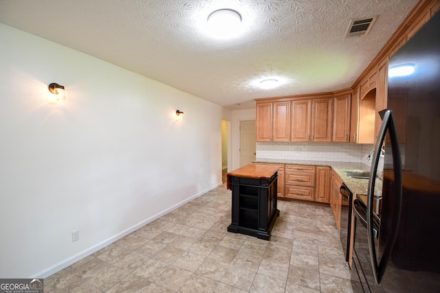 125 Point View Ct, Tyrone, GA 30290 - kitchen featuring freestanding refrigerator, wood counters, tasteful backsplash, a textured ceiling, and open shelves
