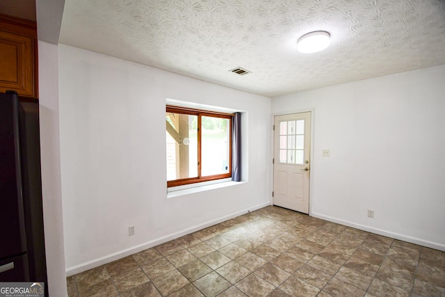 125 Point View Ct, Tyrone, GA 30290 - empty room with a textured ceiling and baseboards
