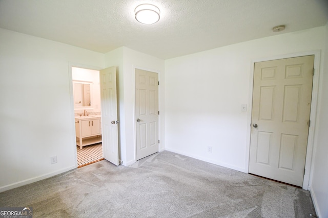 125 Point View Ct, Tyrone, GA 30290 - unfurnished bedroom with carpet floors, a textured ceiling, and ensuite bath