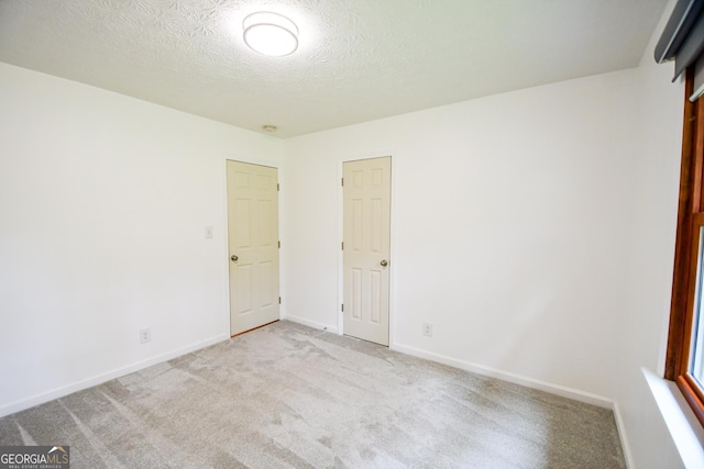 125 Point View Ct, Tyrone, GA 30290 - spare room featuring carpet flooring and a textured ceiling
