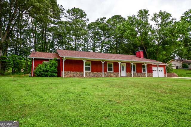 125 Point View Ct, Tyrone, GA 30290 - ranch-style home featuring stone siding, a front lawn, an attached garage, and a chimney