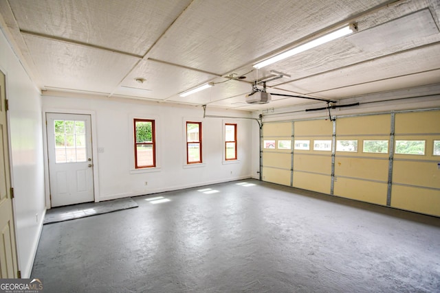 125 Point View Ct, Tyrone, GA 30290 - garage with a garage door opener and baseboards