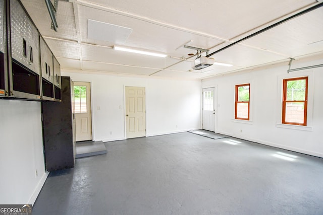 125 Point View Ct, Tyrone, GA 30290 - garage featuring baseboards and a garage door opener