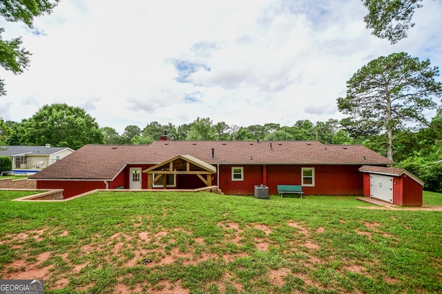 125 Point View Ct, Tyrone, GA 30290 - rear view of property featuring a storage unit, a yard, and a chimney