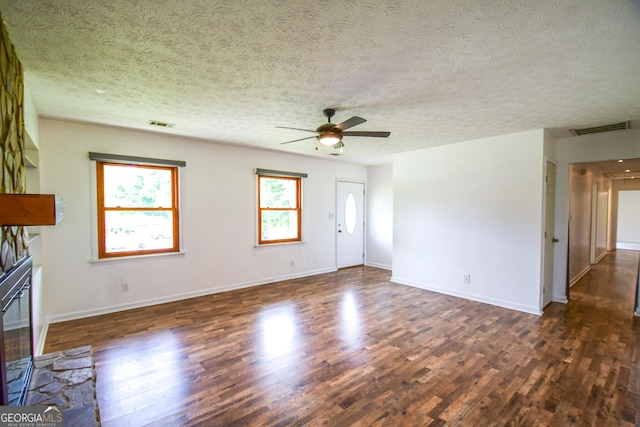 125 Point View Ct, Tyrone, GA 30290 - unfurnished living room with dark wood-type flooring, a ceiling fan, and a textured ceiling