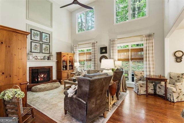 4401 Madison Woods Dr NW Unit 4401, Marietta, GA 30064 - living area with a towering ceiling, ceiling fan, a fireplace, and wood finished floors