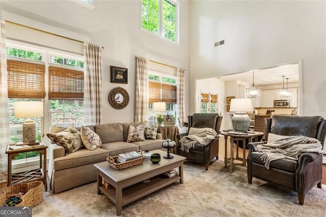4401 Madison Woods Dr NW Unit 4401, Marietta, GA 30064 - living room featuring a high ceiling and a chandelier