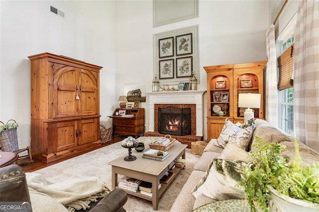 4401 Madison Woods Dr NW Unit 4401, Marietta, GA 30064 - living area featuring a high ceiling, a brick fireplace, and wood finished floors
