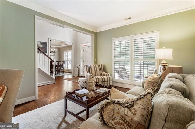 4401 Madison Woods Dr NW Unit 4401, Marietta, GA 30064 - living area featuring stairs, crown molding, wood finished floors, and a chandelier