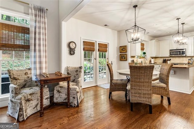 4401 Madison Woods Dr NW Unit 4401, Marietta, GA 30064 - dining space with wood finished floors and a chandelier