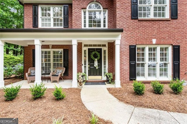 4401 Madison Woods Dr NW Unit 4401, Marietta, GA 30064 - doorway to property featuring covered porch and brick siding