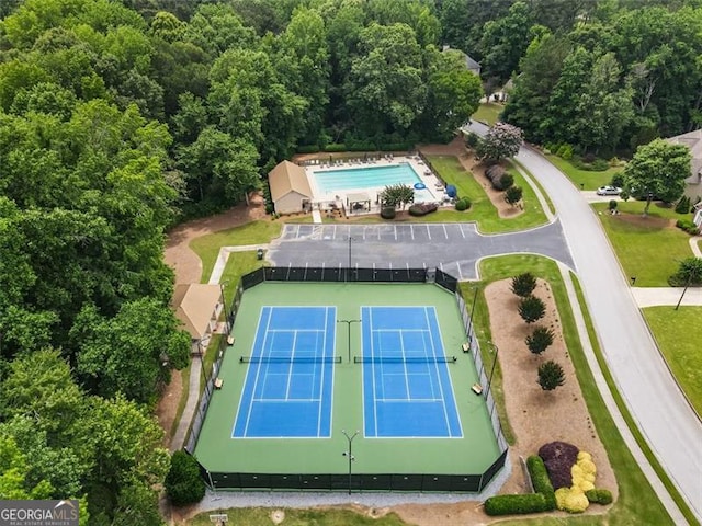 4401 Madison Woods Dr NW Unit 4401, Marietta, GA 30064 - bird's eye view of a pool and a heavily wooded area