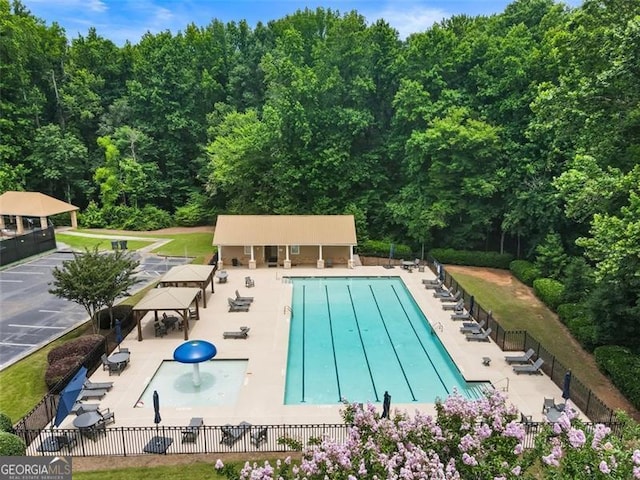 4401 Madison Woods Dr NW Unit 4401, Marietta, GA 30064 - community pool with a patio area, a gazebo, and a wooded view