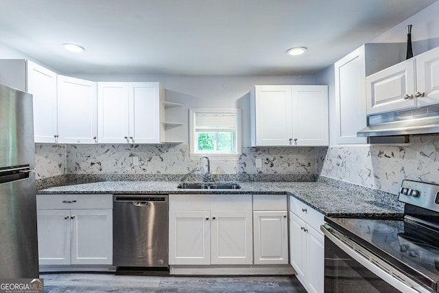 89 Chase Rd, Lagrange, GA 30241 - kitchen with appliances with stainless steel finishes, under cabinet range hood, open shelves, dark stone counters, and white cabinets