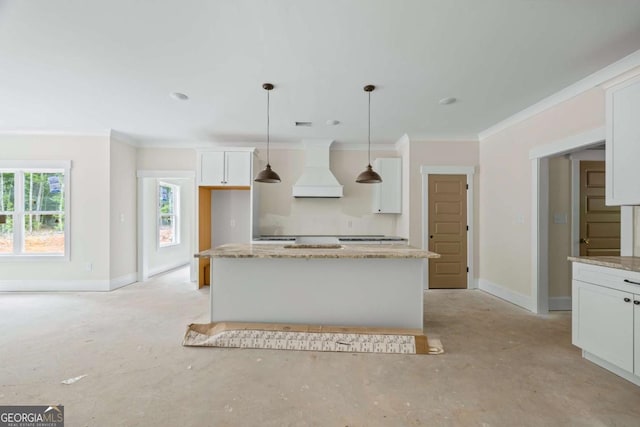 558 Holman Autry Rd, Danielsville, GA 30633 - kitchen featuring premium range hood, crown molding, white cabinetry, light stone counters, and decorative light fixtures