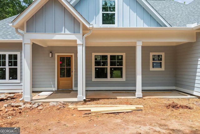 558 Holman Autry Rd, Danielsville, GA 30633 - entrance to property with board and batten siding, roof with shingles, and a porch