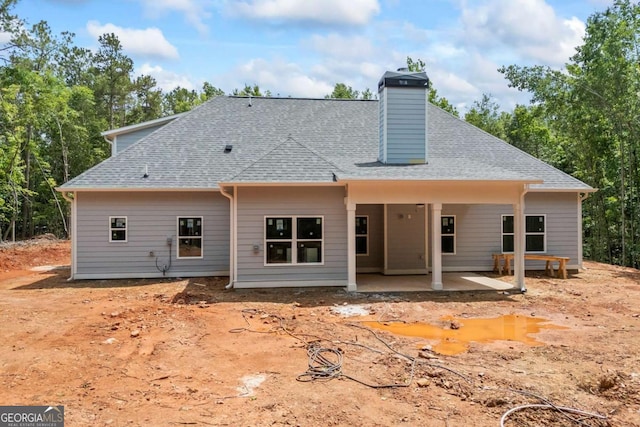 558 Holman Autry Rd, Danielsville, GA 30633 - back of property with a patio area, a shingled roof, and a chimney