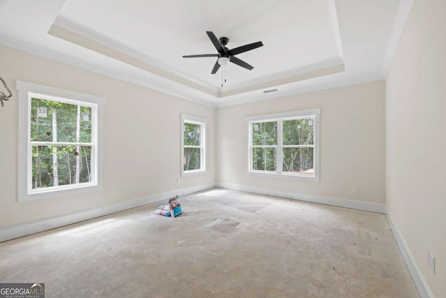 558 Holman Autry Rd, Danielsville, GA 30633 - empty room with a raised ceiling, healthy amount of natural light, and ceiling fan