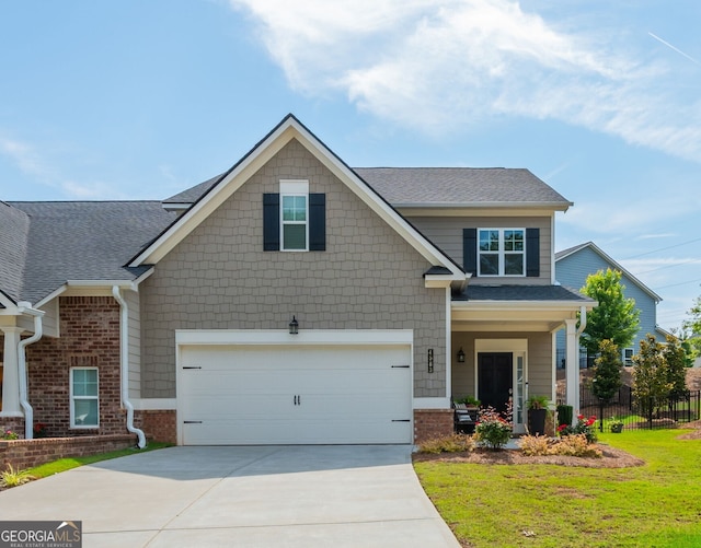 4583 Grenadine Cir, Acworth, GA 30101 - craftsman inspired home featuring concrete driveway, a shingled roof, brick siding, and an attached garage