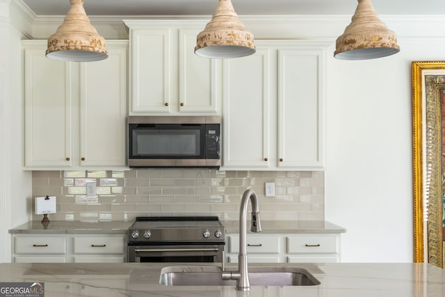 4583 Grenadine Cir, Acworth, GA 30101 - kitchen with appliances with stainless steel finishes, tasteful backsplash, light stone counters, white cabinetry, and pendant lighting