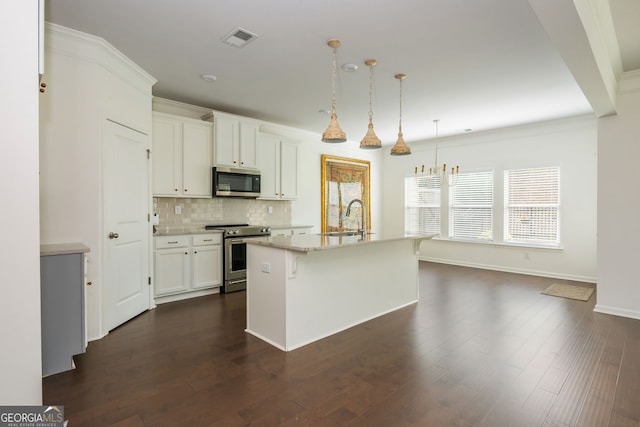 4583 Grenadine Cir, Acworth, GA 30101 - kitchen featuring stainless steel appliances, tasteful backsplash, white cabinets, dark wood-style floors, and decorative light fixtures