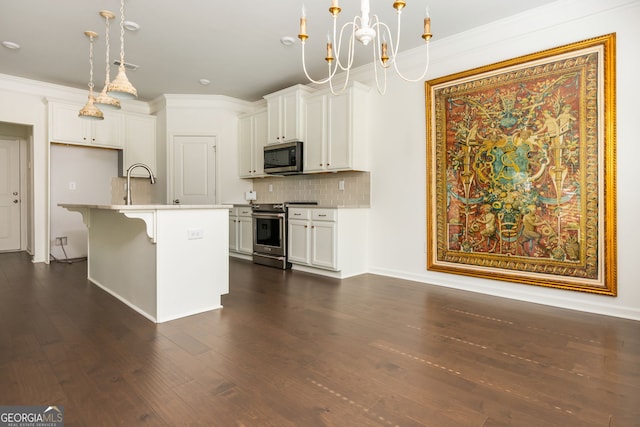 4583 Grenadine Cir, Acworth, GA 30101 - kitchen featuring stainless steel appliances, backsplash, dark wood-style floors, pendant lighting, and ornamental molding