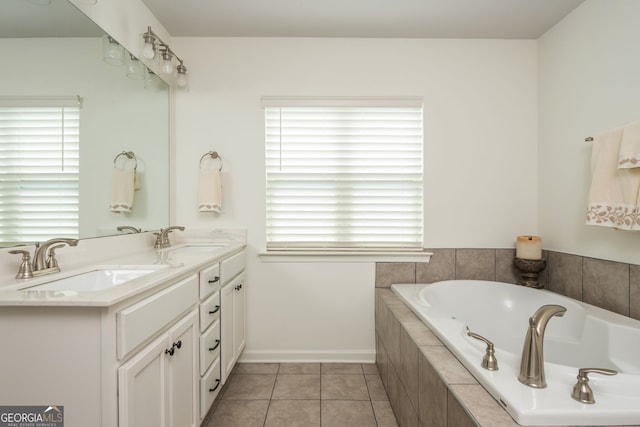 4583 Grenadine Cir, Acworth, GA 30101 - bathroom featuring a garden tub, double vanity, and tile patterned floors