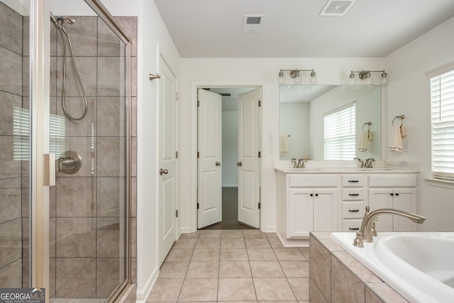 4583 Grenadine Cir, Acworth, GA 30101 - bathroom featuring a shower stall, double vanity, a garden tub, and tile patterned floors