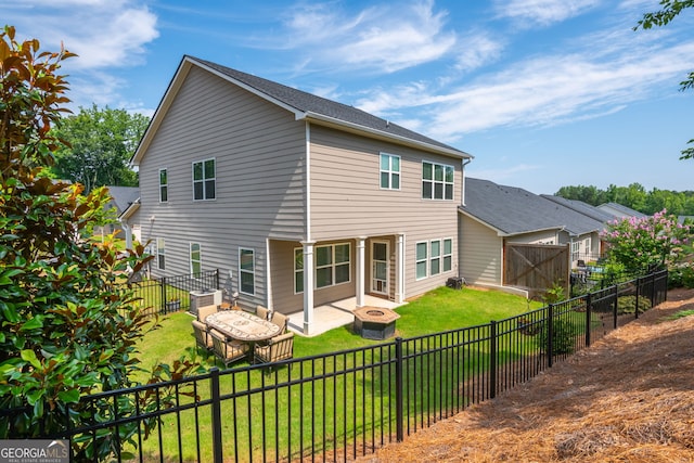 4583 Grenadine Cir, Acworth, GA 30101 - rear view of house with an outdoor fire pit, a fenced backyard, and a patio area