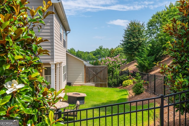 4583 Grenadine Cir, Acworth, GA 30101 - fenced backyard featuring an outdoor fire pit