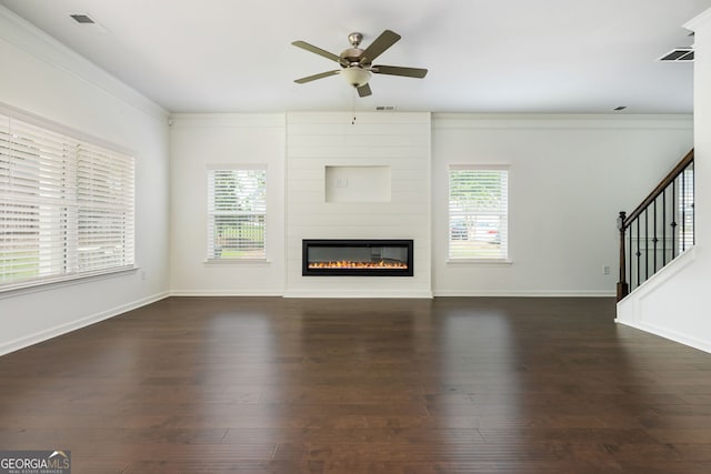 4583 Grenadine Cir, Acworth, GA 30101 - unfurnished living room with a ceiling fan, healthy amount of natural light, a fireplace, stairway, and crown molding