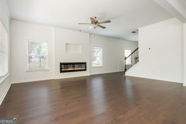 4583 Grenadine Cir, Acworth, GA 30101 - unfurnished living room featuring a fireplace, ceiling fan, crown molding, healthy amount of natural light, and stairway