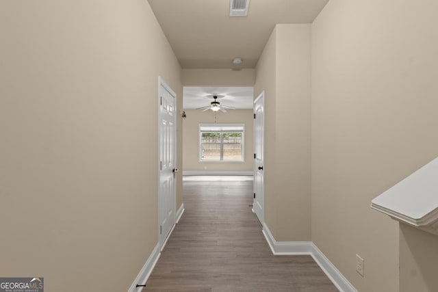 127 Kennedy Blvd, Jackson, GA 30233 - hallway featuring dark wood-style floors and baseboards