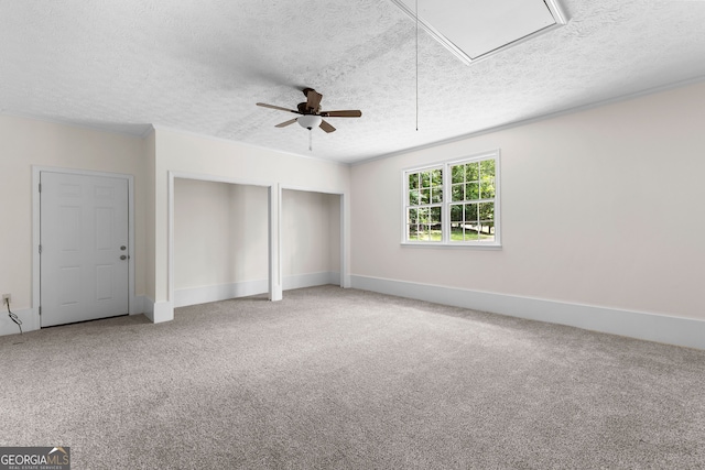223 Pinehaven Dr, Lagrange, GA 30240 - unfurnished bedroom with attic access, a textured ceiling, carpet floors, two closets, and ceiling fan
