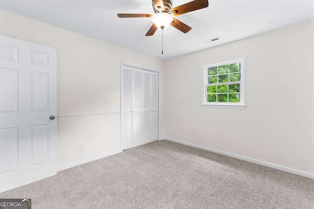 223 Pinehaven Dr, Lagrange, GA 30240 - unfurnished bedroom featuring carpet flooring, a closet, and ceiling fan