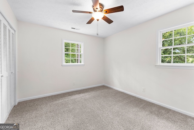223 Pinehaven Dr, Lagrange, GA 30240 - unfurnished bedroom featuring carpet, a closet, and a ceiling fan