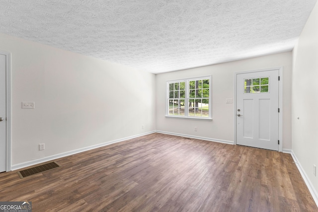223 Pinehaven Dr, Lagrange, GA 30240 - foyer featuring wood finished floors and a textured ceiling