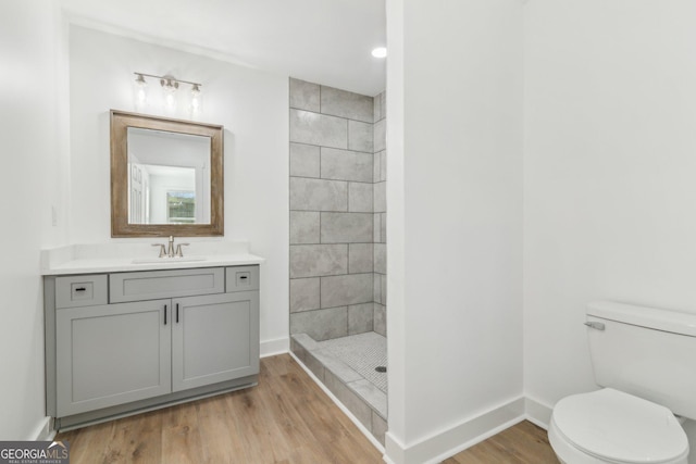 4179 Hanes Dr, Decatur, GA 30035 - bathroom featuring tiled shower, vanity, and wood finished floors