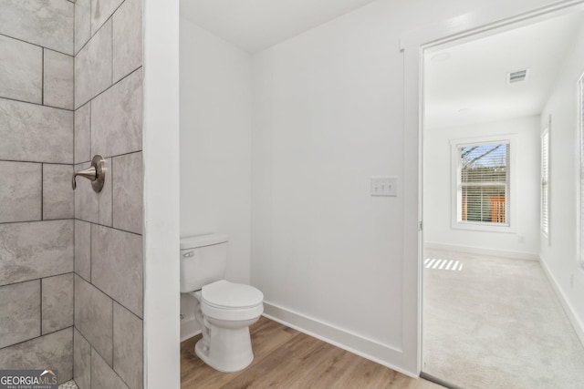4179 Hanes Dr, Decatur, GA 30035 - full bathroom featuring tiled shower and wood finished floors