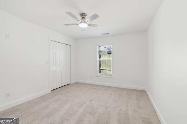 4179 Hanes Dr, Decatur, GA 30035 - unfurnished bedroom featuring carpet flooring, a closet, and a ceiling fan