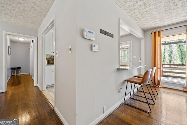 1755 Fairburn Rd SW, Atlanta, GA 30331 - hall with a textured ceiling, hardwood / wood-style floors, and plenty of natural light