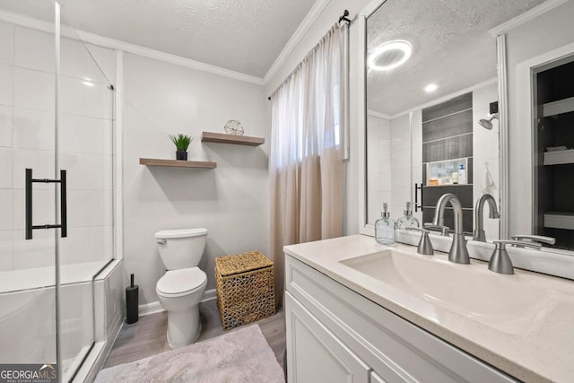 1755 Fairburn Rd SW, Atlanta, GA 30331 - full bathroom featuring a textured ceiling, vanity, a shower stall, crown molding, and wood finished floors