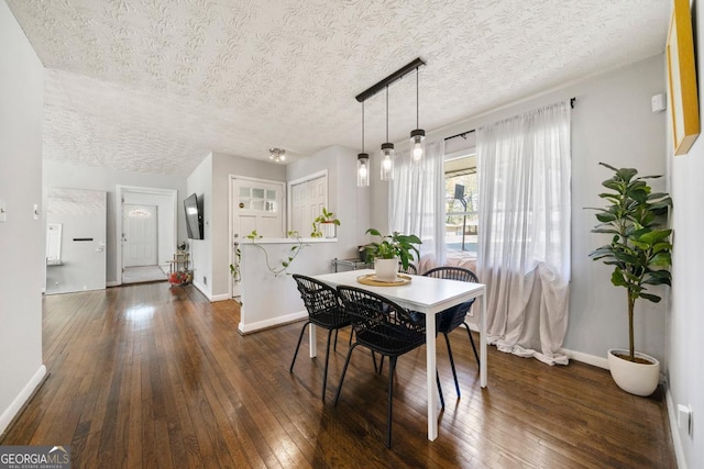 1755 Fairburn Rd SW, Atlanta, GA 30331 - dining area featuring dark wood-type flooring and a textured ceiling