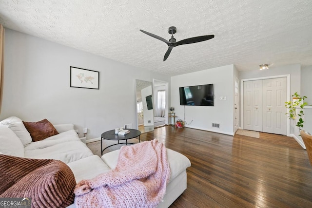 1755 Fairburn Rd SW, Atlanta, GA 30331 - living area featuring a textured ceiling, wood finished floors, and a ceiling fan