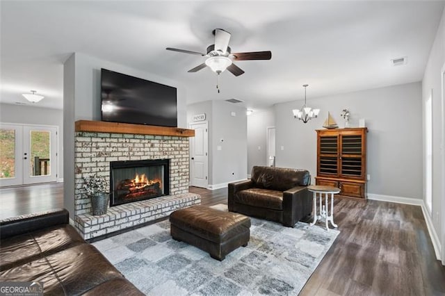 2716 Taylorsville Rd, Taylorsville, GA 30178 - living area with wood finished floors, a ceiling fan, a fireplace, and a chandelier