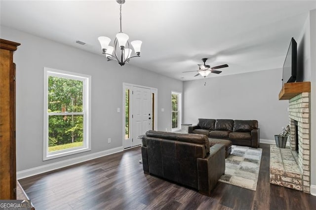 2716 Taylorsville Rd, Taylorsville, GA 30178 - living room with a chandelier, plenty of natural light, a ceiling fan, and dark wood-style flooring