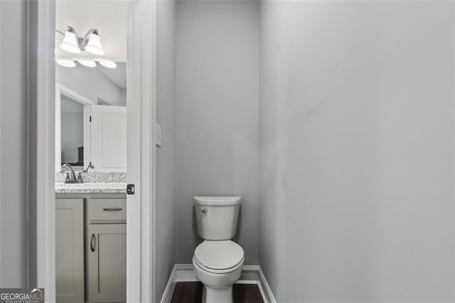 2716 Taylorsville Rd, Taylorsville, GA 30178 - half bathroom with vanity and wood finished floors