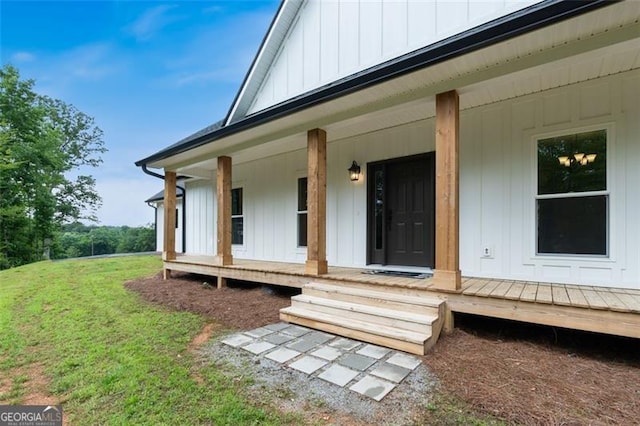 2716 Taylorsville Rd, Taylorsville, GA 30178 - entrance to property featuring covered porch, board and batten siding, and a lawn