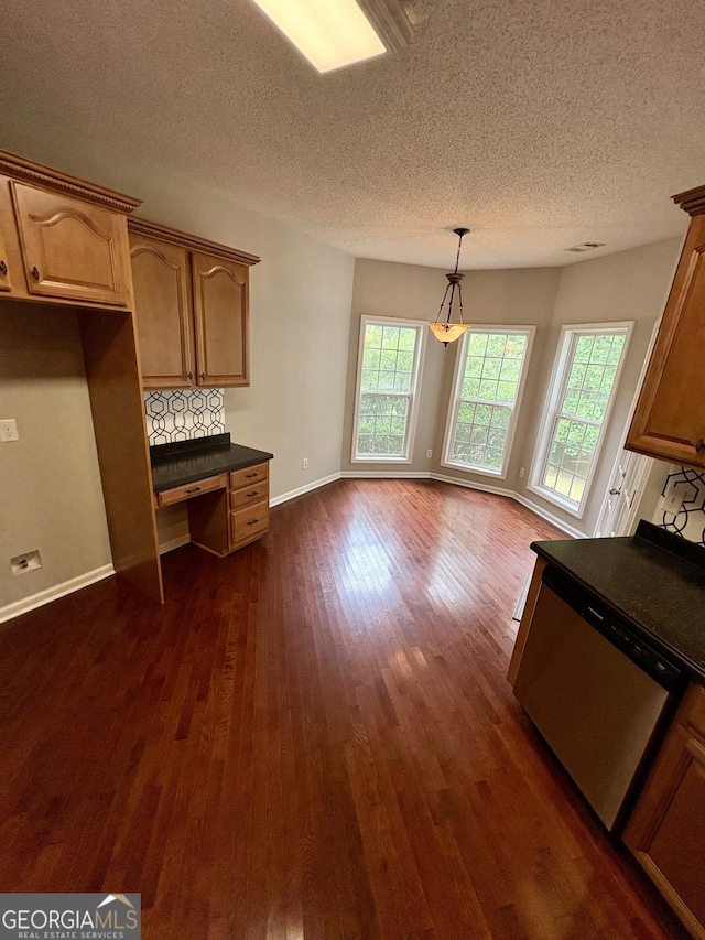 237 Shockley Way, Dallas, GA 30157 - kitchen featuring dark countertops, dark wood-type flooring, a textured ceiling, dishwasher, and pendant lighting